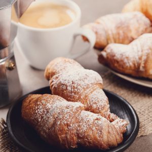Breakfast. Delicious croissants on the table